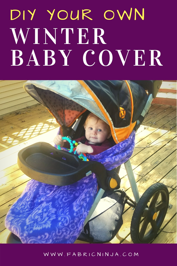 Stroller has a smiling baby with purple cover pulled up to the chin. DIY your own Winter All weather cover. 