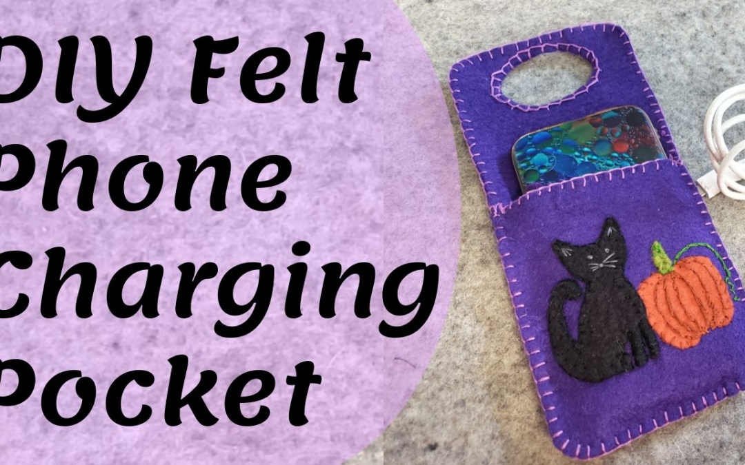 Purple felt cell phone charging pouch with black cat and orange pumpkin. DIY Felt Charging Pocket