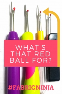 Whats that red ball for? Four different looking colorful seam rippers lined up.