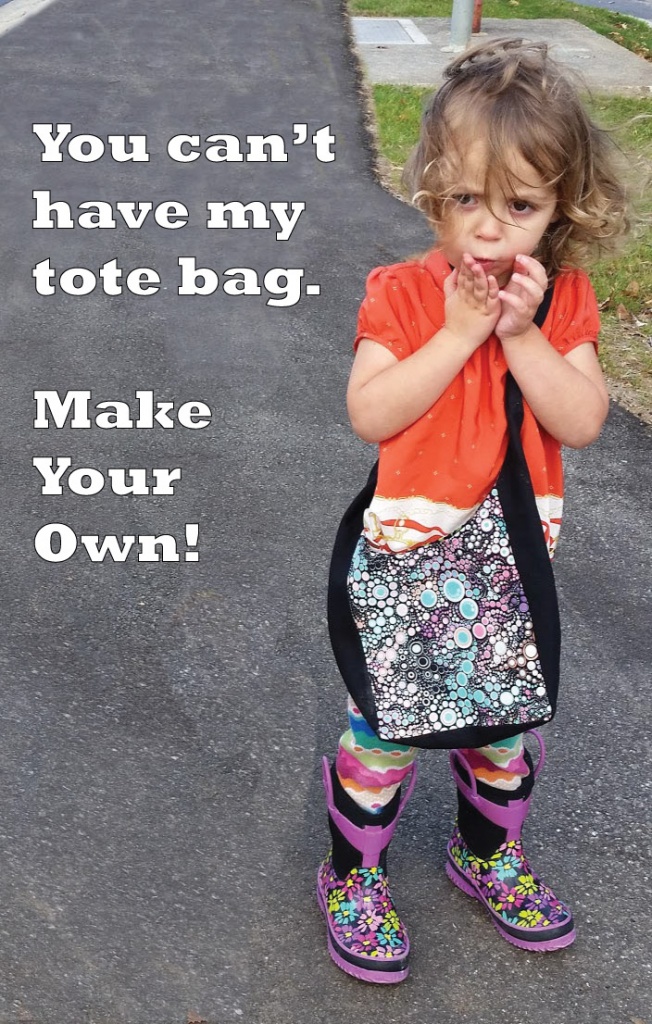 Little curly headed girl with surprised look on her face wearing a tote bag. You can't have my tote bag Make your own! #DIYTotebag #LearntoSew #BeginnerSewing