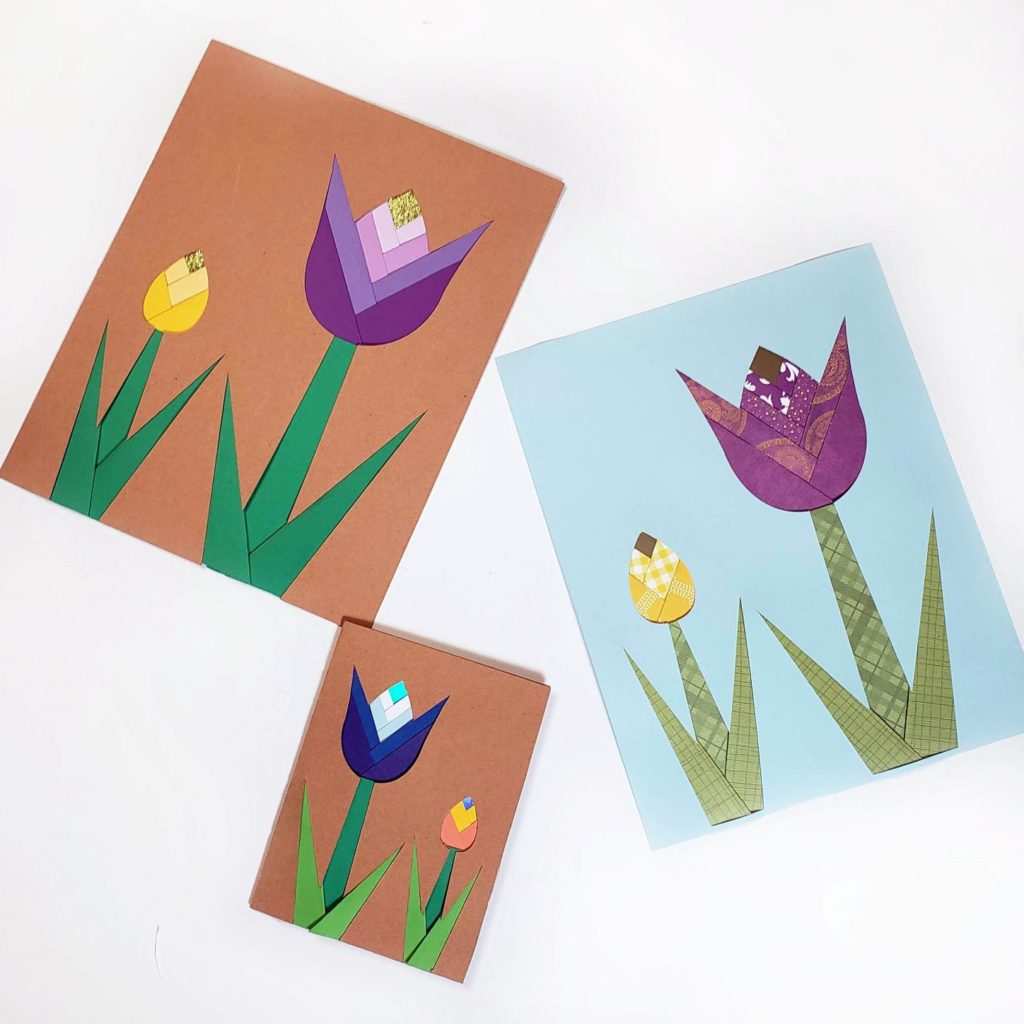Iris paper folding designs that look like Tulips on the front of a card and 2 larger ones made from paper. 