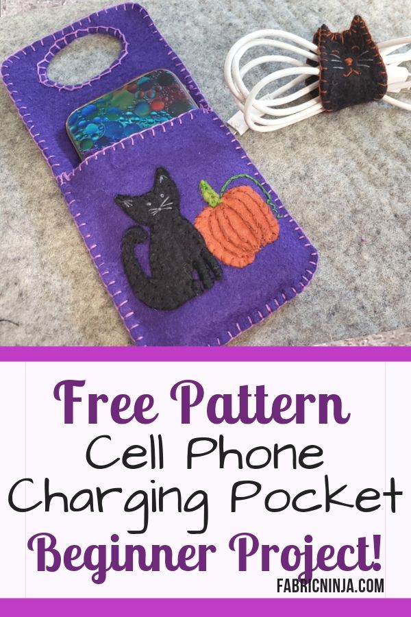 Purple Cell phone charging pocket with black cat and pumpkin.