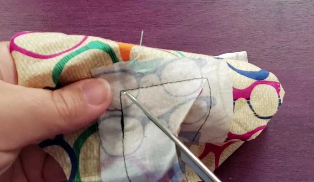 scissors clipping into the corner near sewing. 