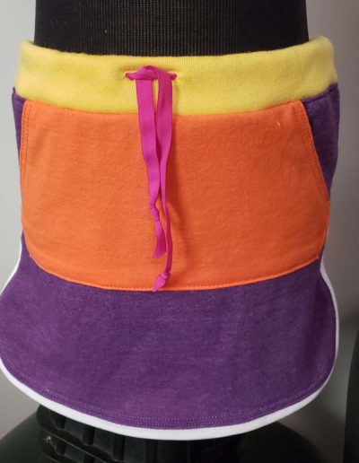 Dolphin skirt with purple base, orange kangaroo packet and yellow waist band.