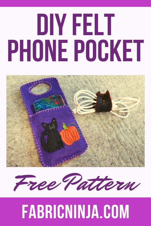 Purple Cell phone charging pocket with black cat and pumpkin.