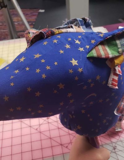 Hobby horse head - blue fabric with gold stars. Maine and inside of ears is rainbow plaid