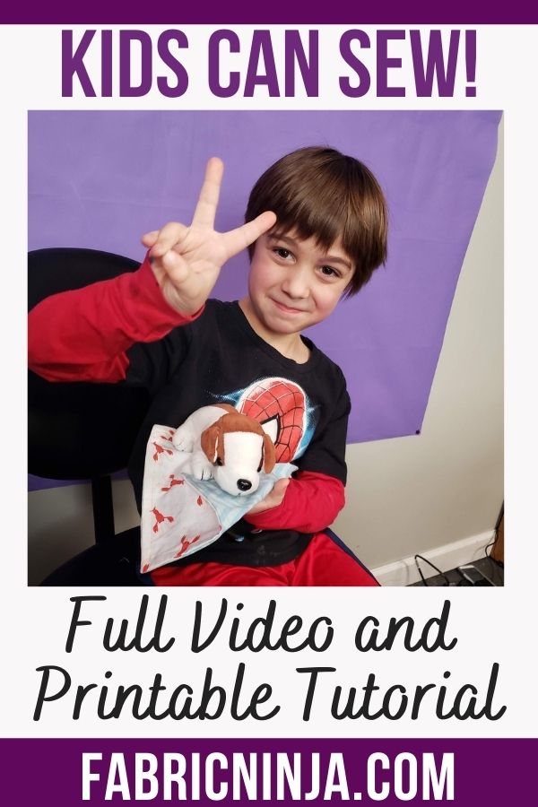 image of a young boy giving the peace sign holding a stuffed animal toy dog and his sewing project. Kids Can Sew! Full video and printable tutorial