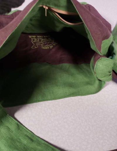 Linen tote bag with turtle and pockets inside.