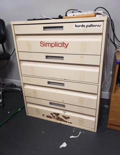 Before image of simplicity sewing pattern cabinet that I rehabilitated.