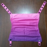 pink to purple fabric made into a sleeping hood