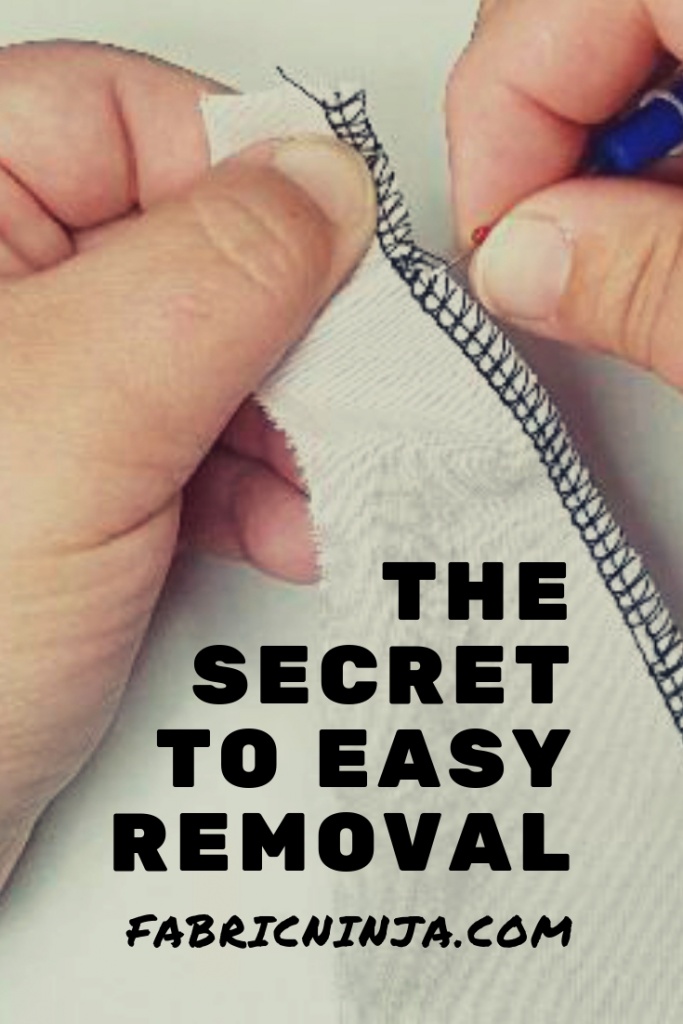 Close-up hands holding seam ripper and a piece of fabric with a serged edge. The Secret of Easy removal