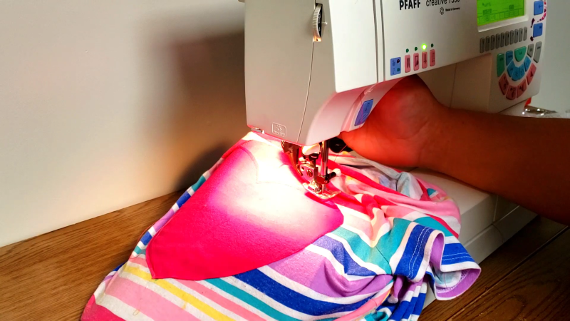 sewing carefully around the pink hearts curves