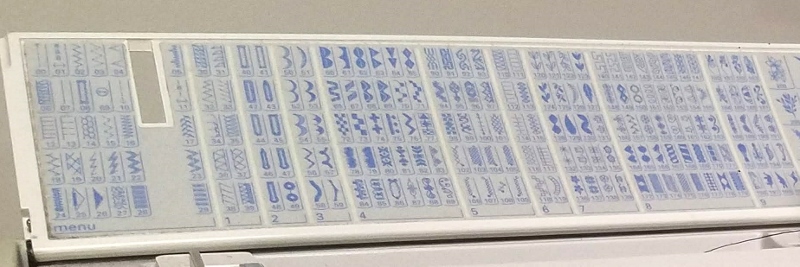 top panel of sewing machine showing hundreds of stitches