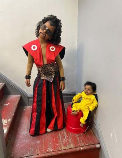 Reproduction Last Dragon Sho Nuff modeled by young black girl cosplaying