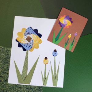Swirled Flower design and card. Iris paper folding Flowers are swirled with blue and yellow and purple and yellow paper with green stems