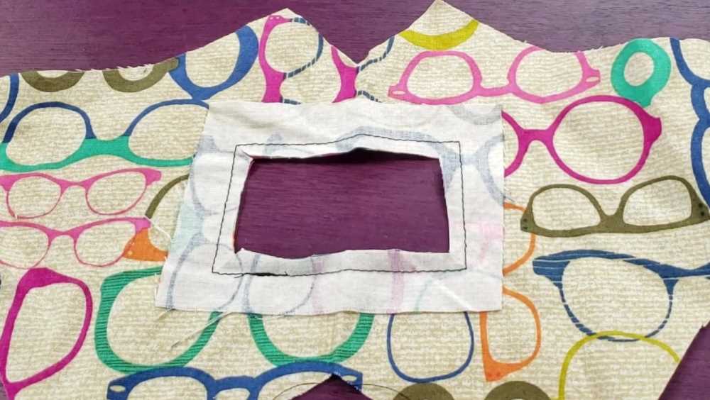 A rectangle opening in the center of the fabric mask