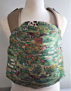Freen farm themed overlay for the happy baby toddler carrier on a tan carrier
