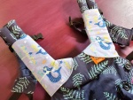 Blue mermaid suck pads on the Tula Explore Carrier