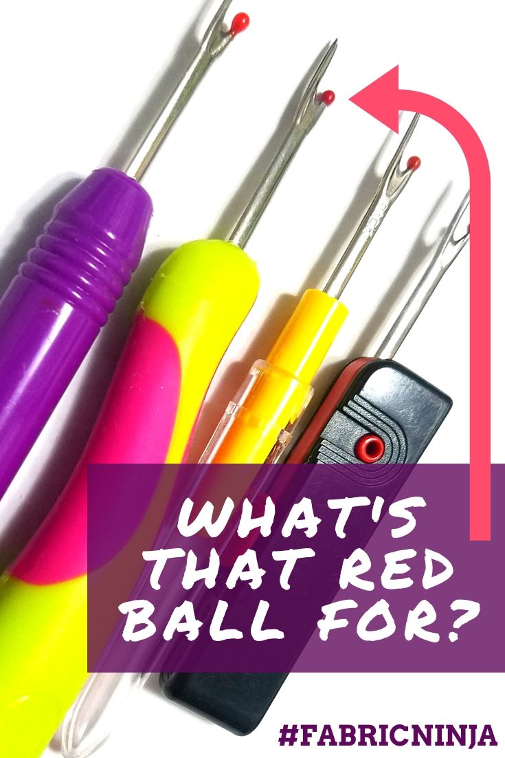 4 sewing seam rippers (purple, yellow & pink, yellow, and black) at and angle. An arrow is pointing to the tip of one "Whatts that red ball for"